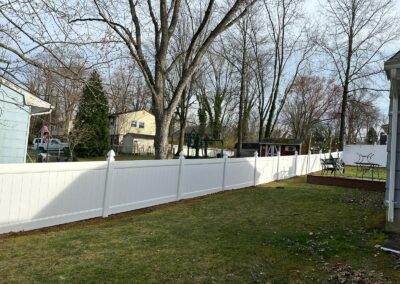 Vinyl fence by Fence Imperial, showcasing a sleek and modern design with low-maintenance features for a contemporary look.