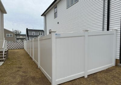 Vinyl fence by Fence Imperial, showcasing a sleek and modern design with low-maintenance features for a contemporary look.