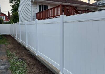 Vinyl fence by Fence Imperial, showcasing a sleek and modern design with low-maintenance features for a contemporary look.