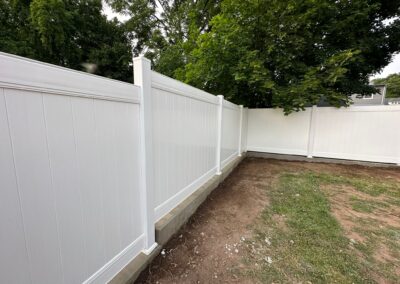 Vinyl fence by Fence Imperial, showcasing a sleek and modern design with low-maintenance features for a contemporary look.