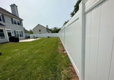 Vinyl fence by Fence Imperial, showcasing a sleek and modern design with low-maintenance features for a contemporary look.