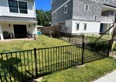 Aluminum fence by Fence Imperial, featuring a sleek and modern design with durable construction for enhanced security and style.