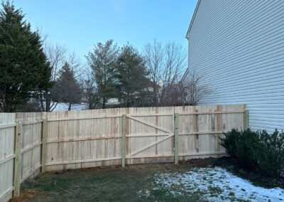 Classic wood fence installed by Fence Imperial, demonstrating elegant craftsmanship and natural beauty for enhancing property aesthetics.