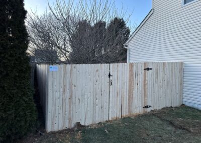 Classic wood fence installed by Fence Imperial, demonstrating elegant craftsmanship and natural beauty for enhancing property aesthetics.