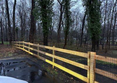 Classic wood fence installed by Fence Imperial, demonstrating elegant craftsmanship and natural beauty for enhancing property aesthetics.