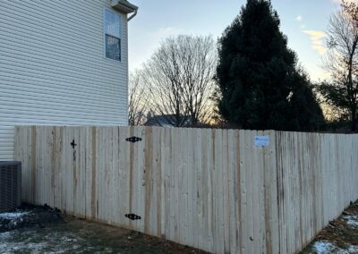 Classic wood fence installed by Fence Imperial, demonstrating elegant craftsmanship and natural beauty for enhancing property aesthetics.