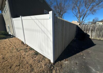 Classic wood fence installed by Fence Imperial, demonstrating elegant craftsmanship and natural beauty for enhancing property aesthetics.