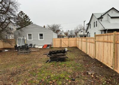 Classic wood fence installed by Fence Imperial, demonstrating elegant craftsmanship and natural beauty for enhancing property aesthetics