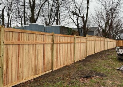 Classic wood fence installed by Fence Imperial, demonstrating elegant craftsmanship and natural beauty for enhancing property aesthetics