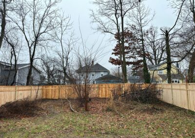 Classic wood fence installed by Fence Imperial, demonstrating elegant craftsmanship and natural beauty for enhancing property aesthetics