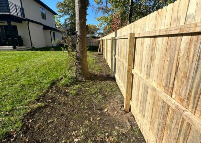 Classic wood fence installed by Fence Imperial, demonstrating elegant craftsmanship and natural beauty for enhancing property aesthetics