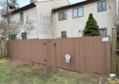 Classic wood fence installed by Fence Imperial, demonstrating elegant craftsmanship and natural beauty for enhancing property aesthetics.