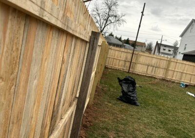 Classic wood fence installed by Fence Imperial, demonstrating elegant craftsmanship and natural beauty for enhancing property aesthetics.